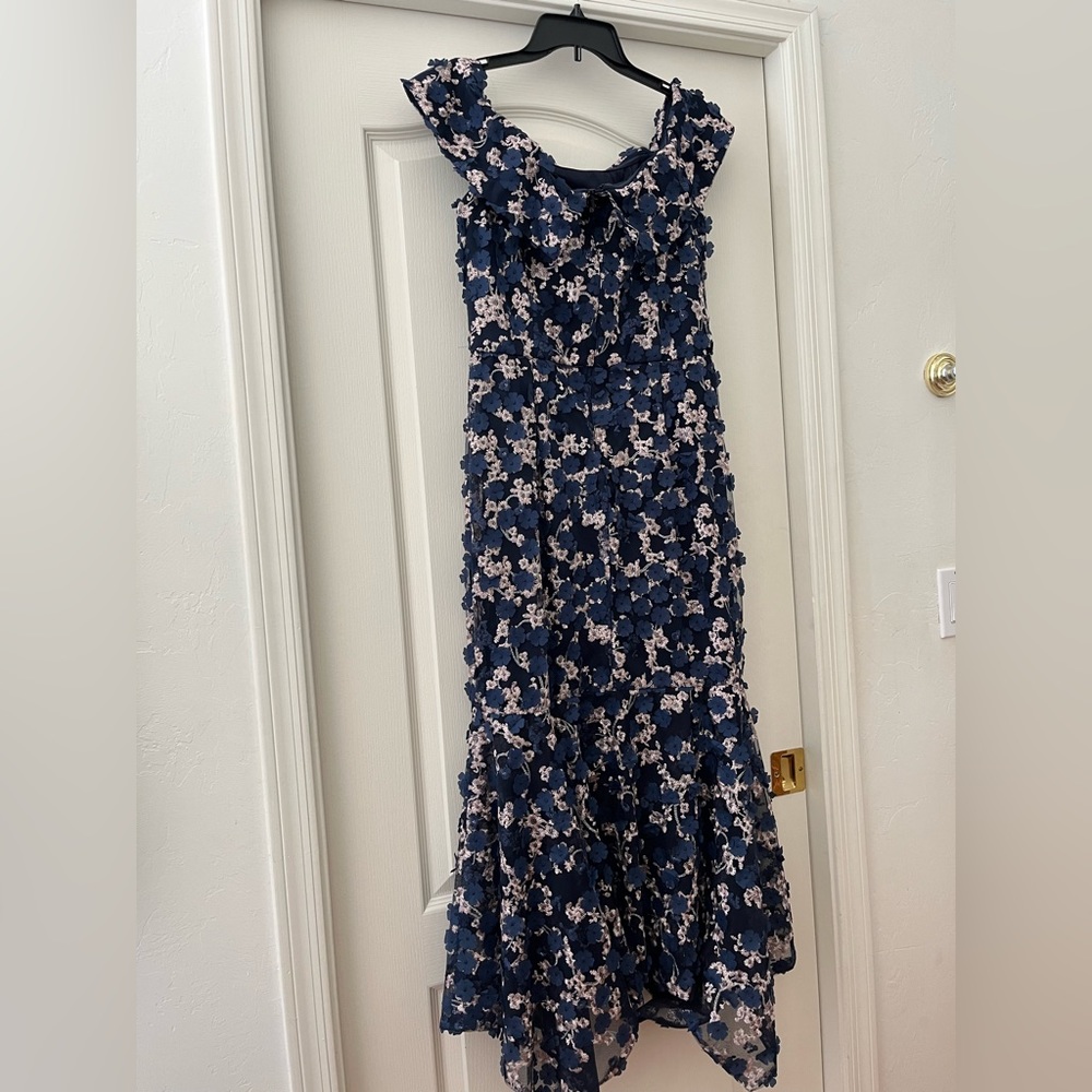 Beautiful off the shoulders Xscape dress. Wore it for my daughter’s wedding.
